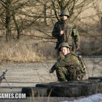 Boy gets punished by two soldiers - Picture 1