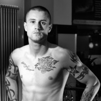 The heavily tattooed tough guy - Picture 1