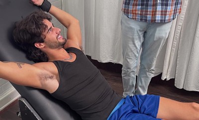 Dan Edwards tickles Zeke Stone’s feet