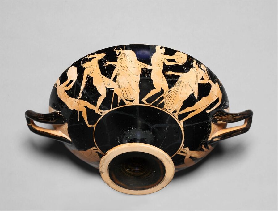 Red-figure drinking cup decorated with nude athletes training around its outer wall