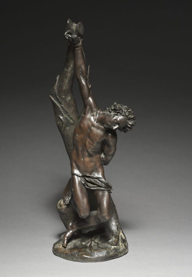 Bronze statuette of a nude young man with a loincloth, his arms tied above his head to a tree trunk, his head turned down