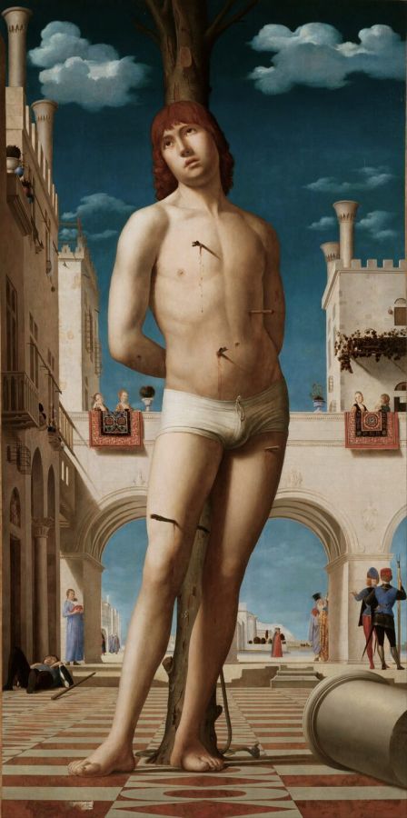 A nearly naked man in a white loincloth tied to a tree in a paved Italian square, pierced by arrows, gazing upwards