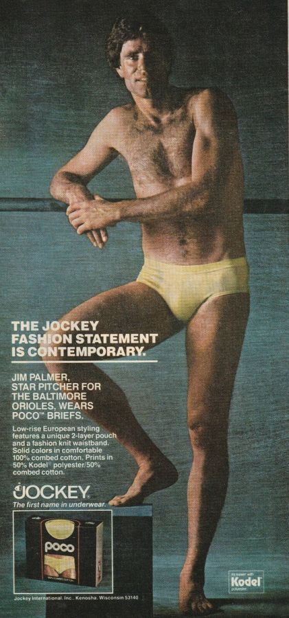 Magazine advertisement of a tall athletic man with a hairy chest in yellow briefs, one foot raised on a block, with the text The Jockey fashion statement is contemporary