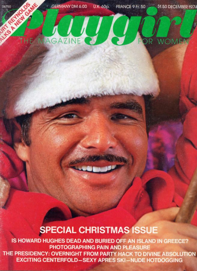 Magazine cover with the title Playgirl in green, showing Burt Reynolds smiling broadly in a Santa Claus hat, with the line Special Christmas Issue