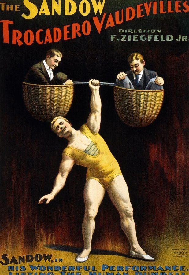 Colour theatre poster showing Eugen Sandow in a yellow leotard lifting over his head a bar with two baskets, each holding a man in a suit