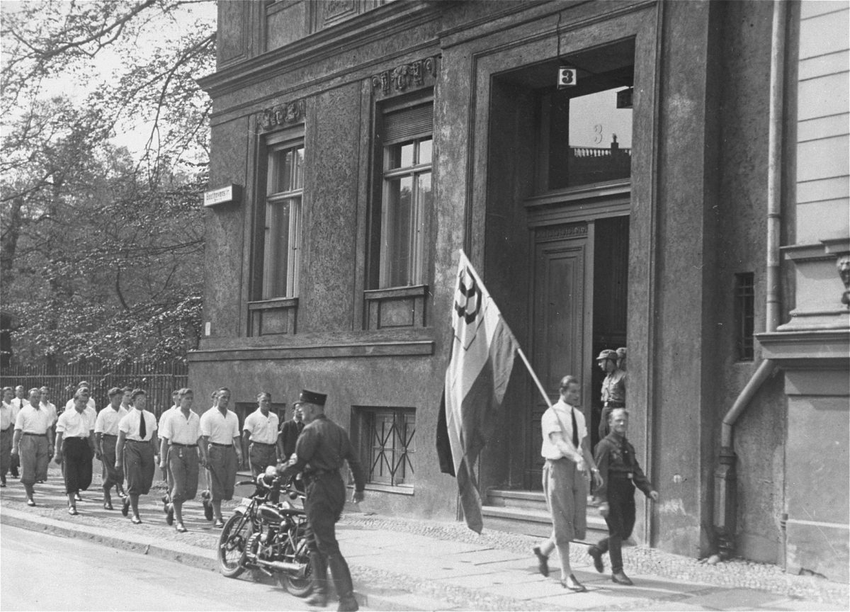 Nazi students marching in front of the Institute for Sexual Science in Berlin, 1933