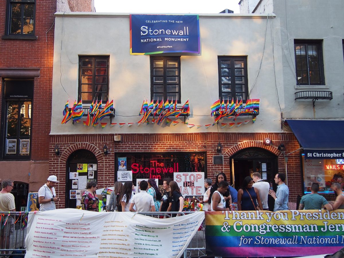 The Stonewall Inn on Christopher Street, with rainbow flags