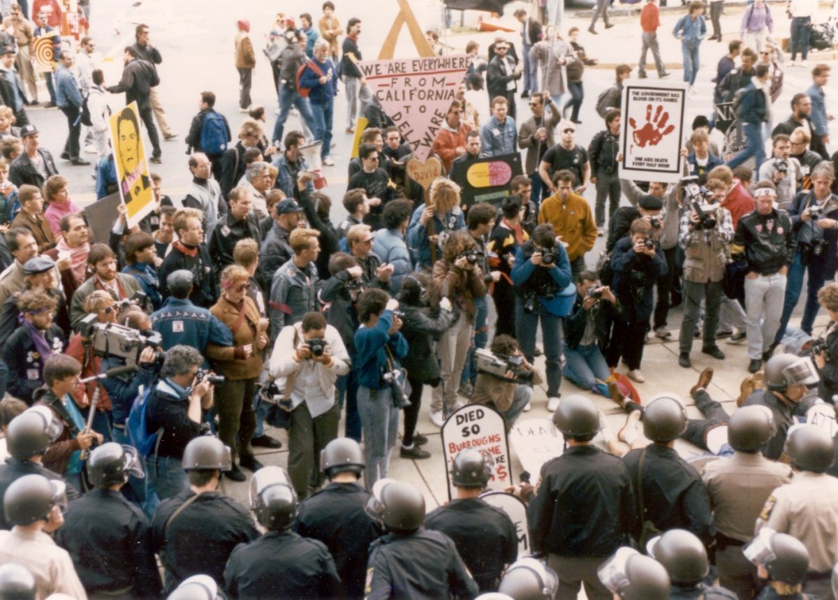 ACT UP protesters facing police in helmets outside the FDA, 1988